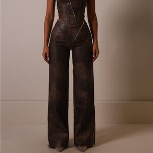 Brown leather trousers mars the label